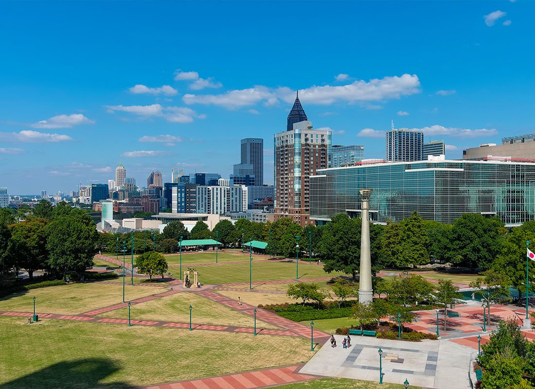 About Our Agency - A Stunning Shot of the Skyscrapers in Downtown Atlanta and Centennial Olympic Park in Atlanta Georgia